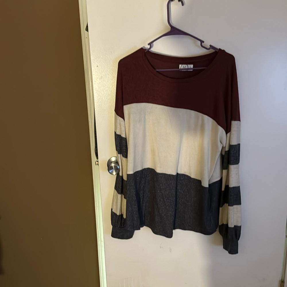 Long sleeve burgundy cream and gray shirt.